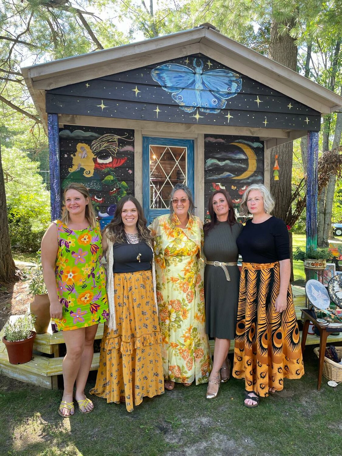 Artists invited by Genvieve Wolfrum to paint murals at Goddess Studio attended an open house in their honor on Saturday, Sept. 9. Left to right: Rebecca Mann, Mary Starr, Genevieve Wolfrum, Jess Diponio, and Kelly Crandall.